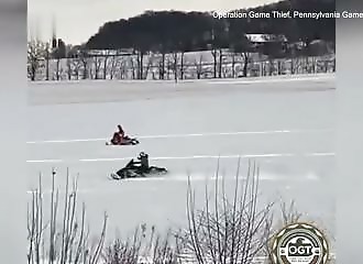 Two young snowmobilers deliberately hit a fox on a frozen lake
