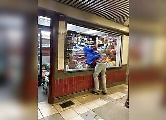 Sweeping up doesn't stop him from stealing a stall of delicacies