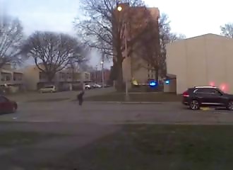 The Ring camera films everything: a shooting, a fleeing car, and a woman standing in the middle of the bullets.