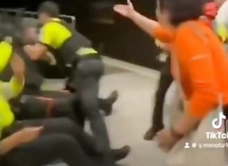 The crowd tries to defend a man who entered the metro on his scooter