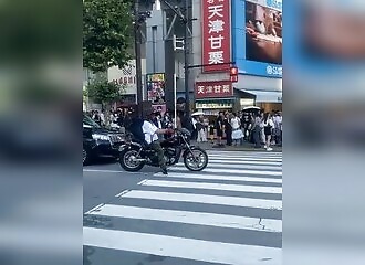 A motorcyclist (intentionally?) hits a pedestrian and then reacts very strangely