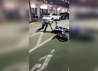Motorcyclist panics as police car approaches