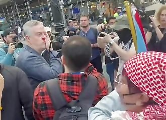 Israeli attacked and bloodied for taking out an Israeli flag at a pro-Palestinian rally