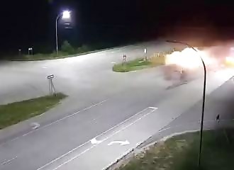 He survives as his car explodes after being hit by a semi-trailer